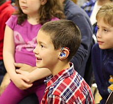 Child with hearing aid